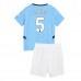 Maglia Manchester City Stones 5 Bambino Divisa Prima 2024/25