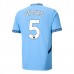 Maglia Manchester City Stones 5 Divisa Prima 2024/25